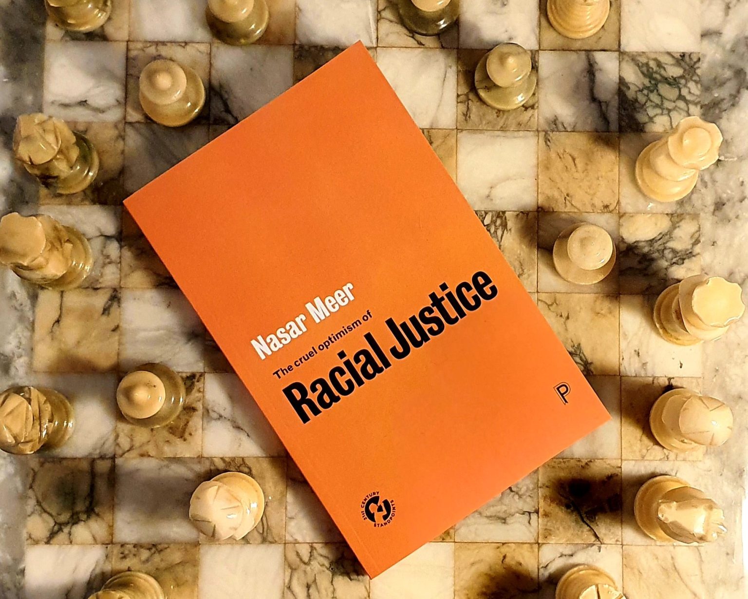 An orange book. Nasar Meer: The cure optimism of Racial Justice