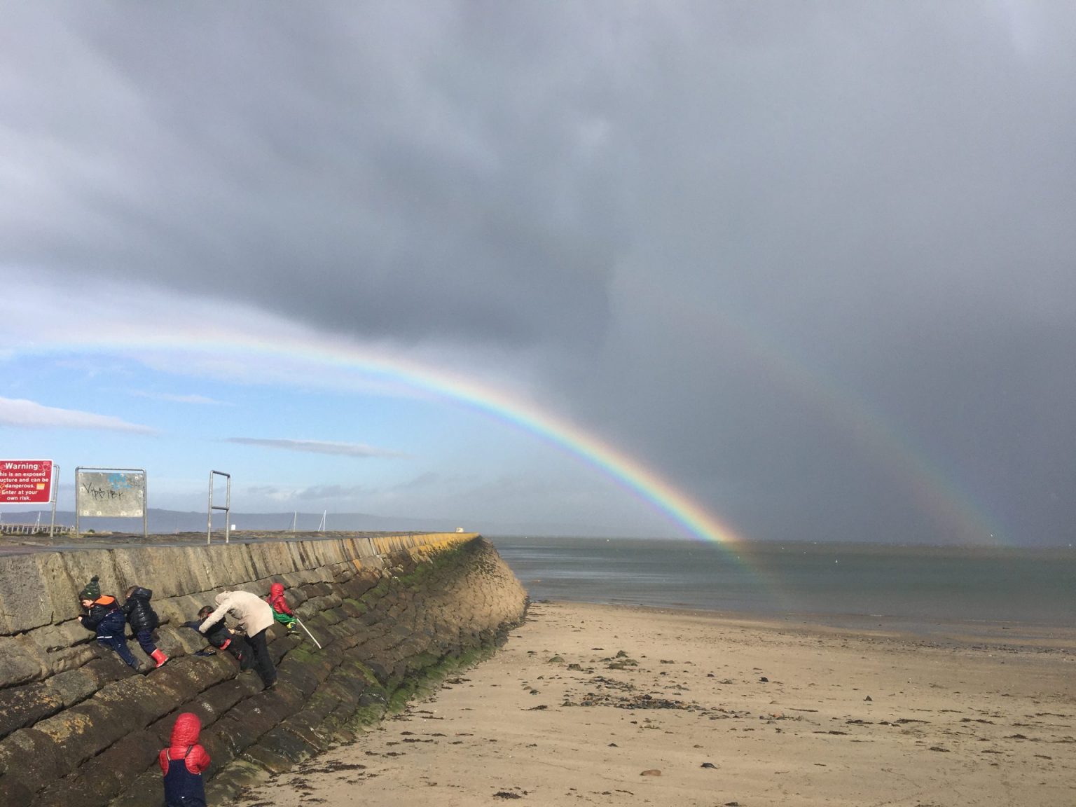 A rainbow by the sea