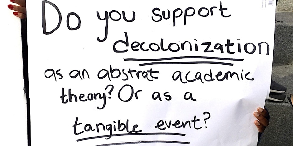 A sign saying: Do you support decolonization as an abstract academic theory? Or as a tangible event?