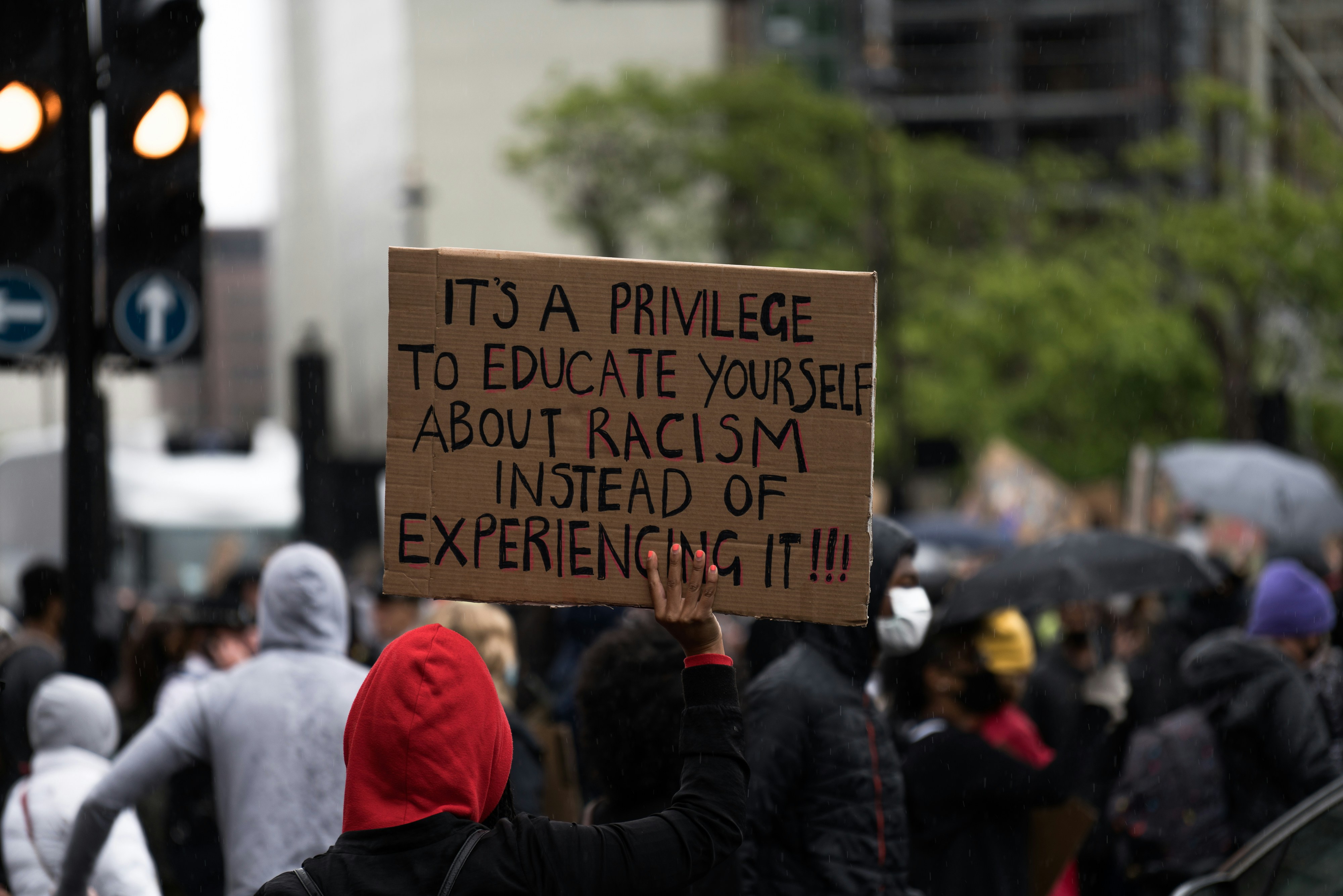 Anti-racism placard being held up during a protest