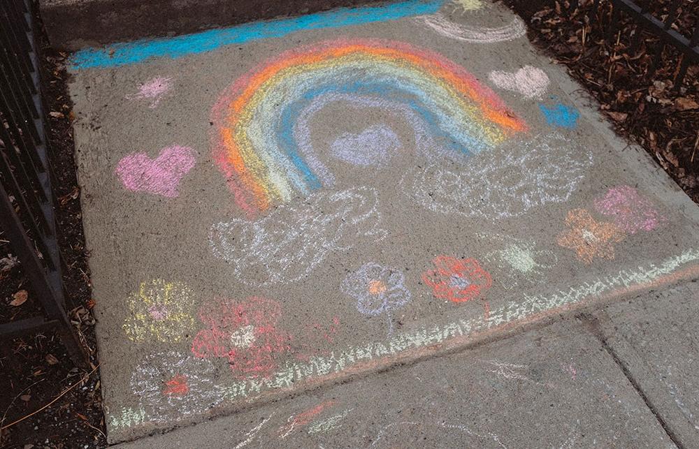 rainbow drawn on the ground with chalk
